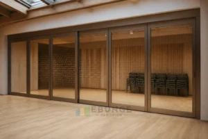 EBUNGE framed movable glass partition concept for cultural centre rehearsal studio bronze
