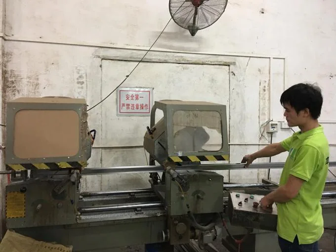 EBUNGE worker preparing aluminum profiles for wider partition production