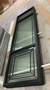 Real EBUNGE black-framed glass partition panel during production