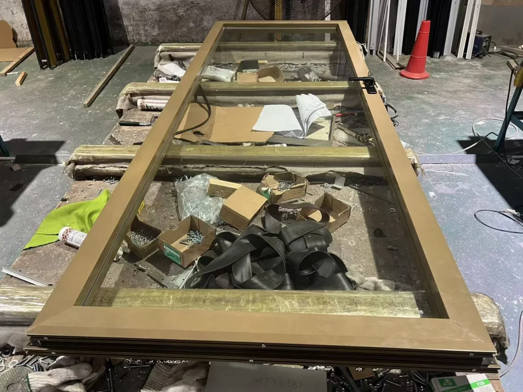 Real EBUNGE framed glass partition panel prepared in the workshop