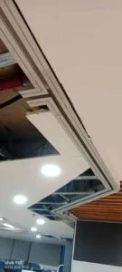 Real overhead track installation detail for a glass partition project