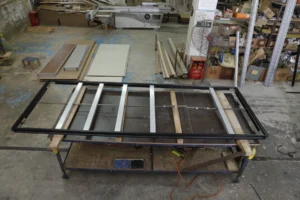 Real EBUNGE framed glass partition panel prepared for quality inspection