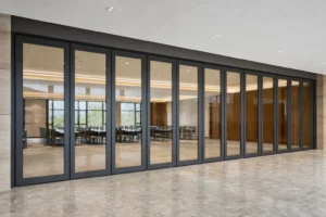 Completed conference venue with a clear lobby route beside a framed movable glass wall