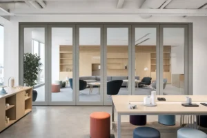 Completed corporate innovation lab divided by a framed movable glass wall